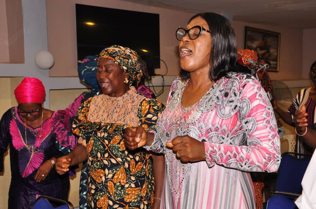 Women worshipping in fellowship